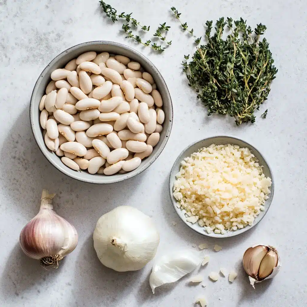 white-bean-casserole-ingredients Ingredients for a white bean casserole including Northern white beans, garlic, onions, and herbs