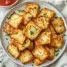 Homemade cottage cheese chips with dip in a rustic kitchen setting